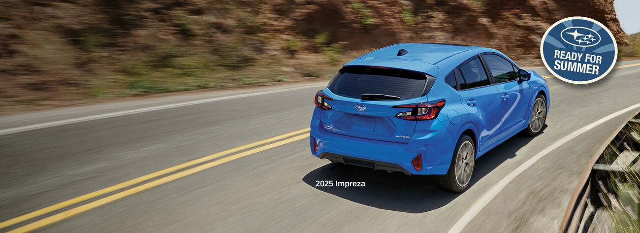 Impreza driving on road.