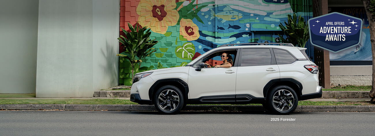 Forester parked by street mural.