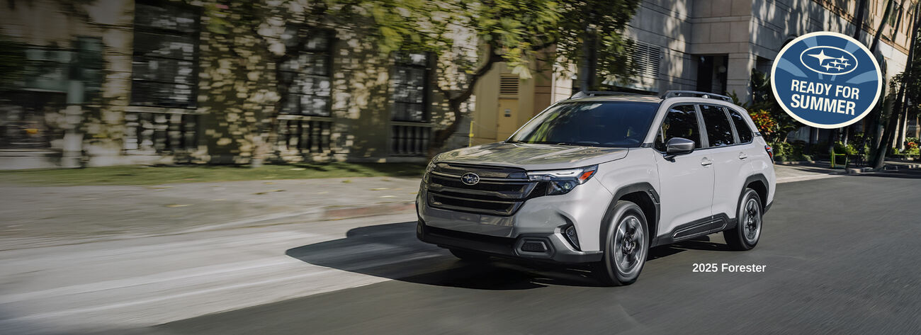 Forester driving down the street. Forester driving down the street.